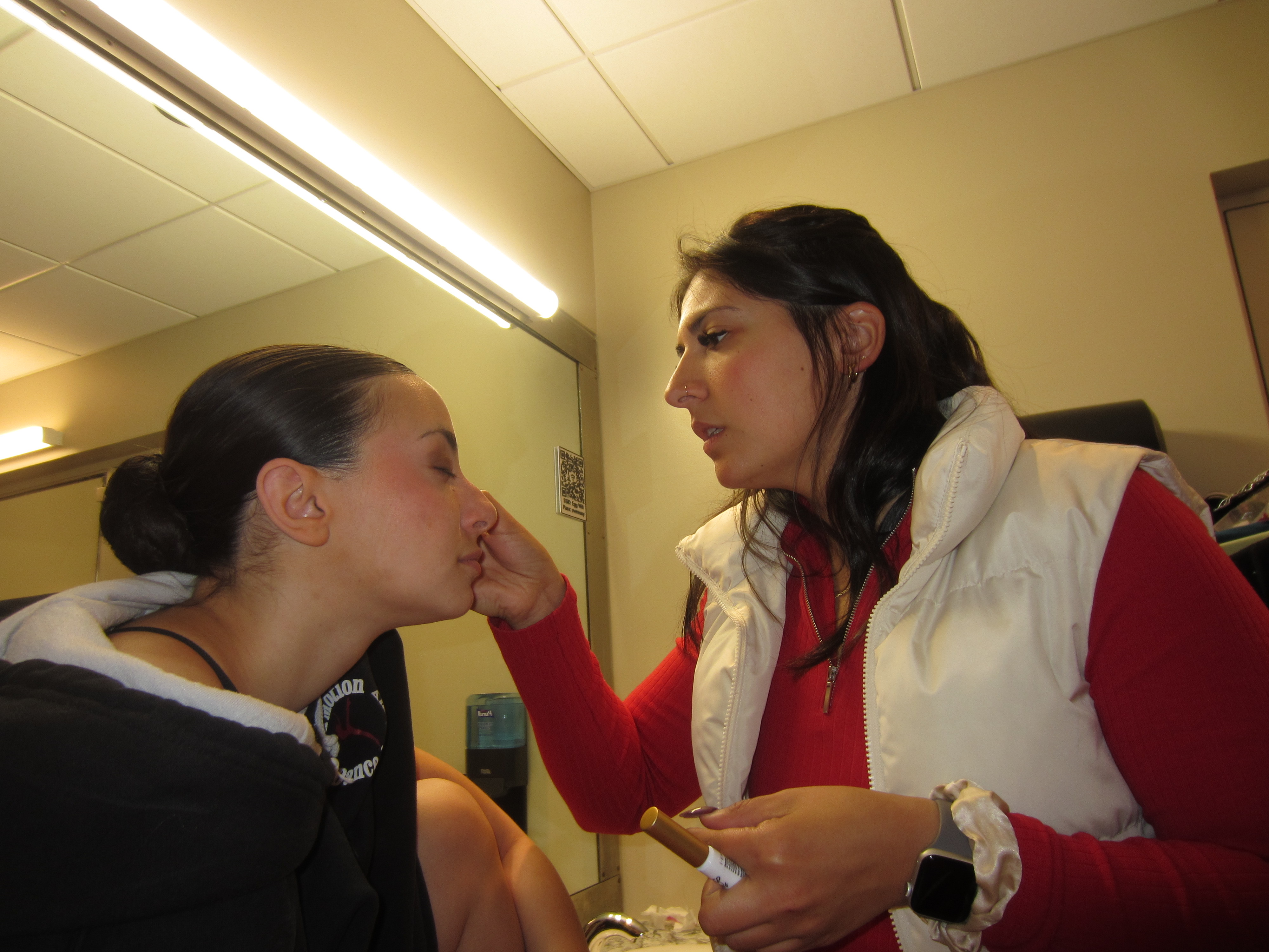 Backstage makeup before a performance