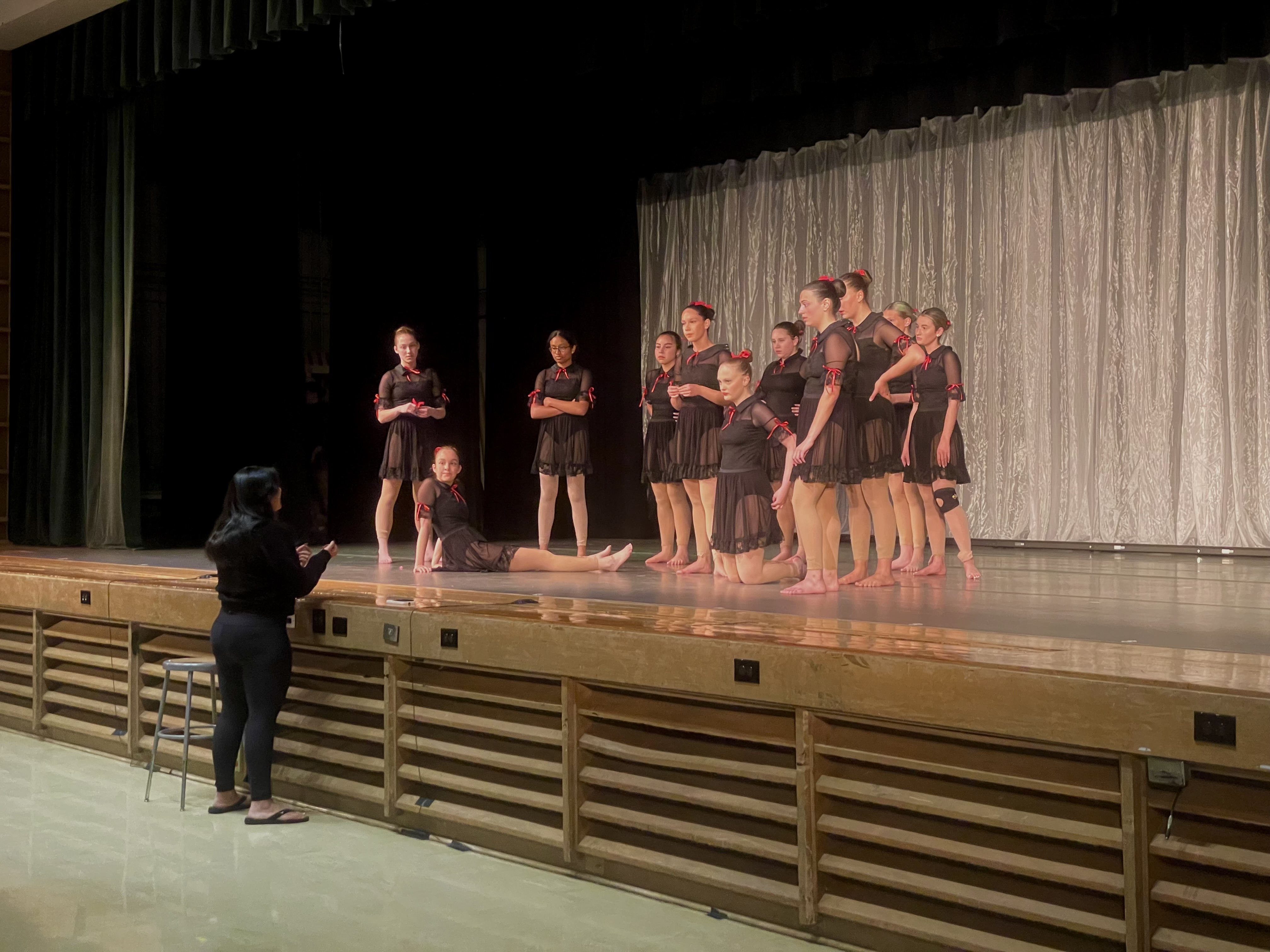 Michaela coaching a competition piece on stage